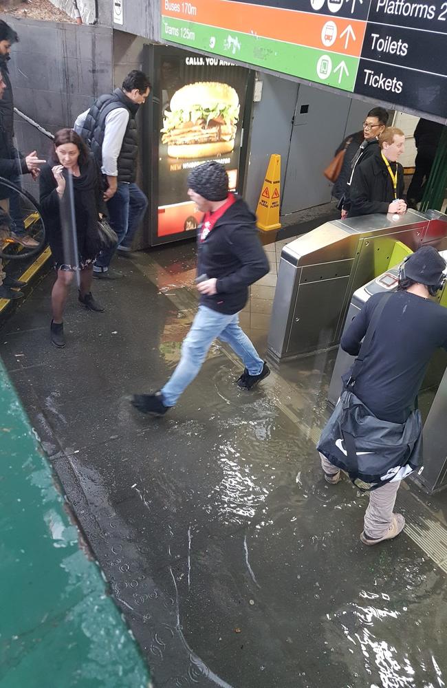 Flooding at Flinders St subway after a sudden downpour of rain. Picture: Shaun Campbell