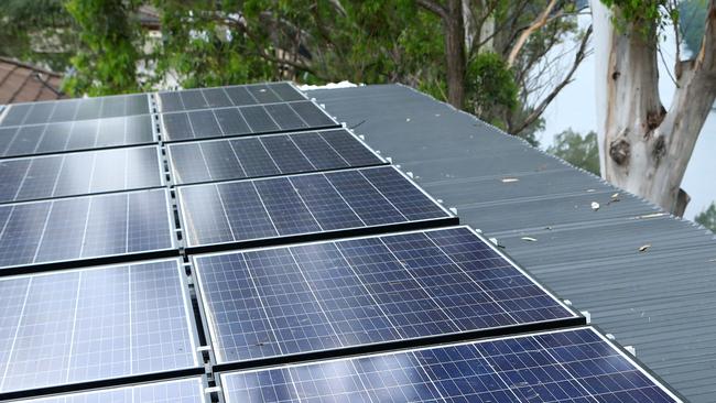 19/12/2018: Rod Grono is a small solar panel installer /repairer and electrician who estimates 50 per cent of his business is fixing badly-installed solar panels. He is the face, the man, the expert behind Western Sydney Solar. He's installing solar panels at a house in Freemans Reach on Wednesday afternoon. Hollie Adams/The Australian