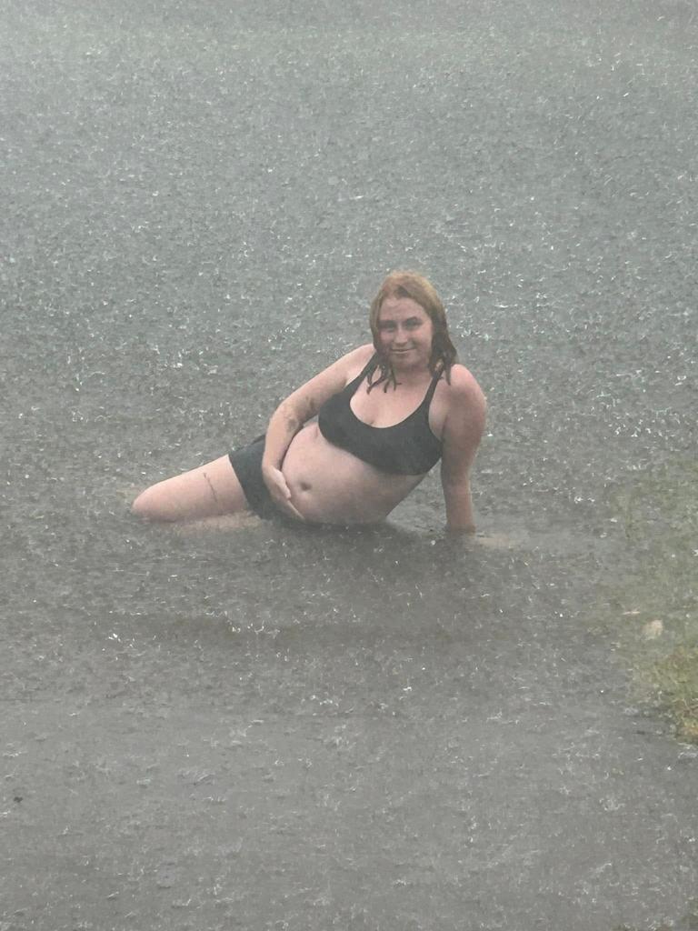 Jasmyne Pinkster of Eli Waters braves the rain amid the wild weather brought by ex-Tropical Cyclone Alfred.