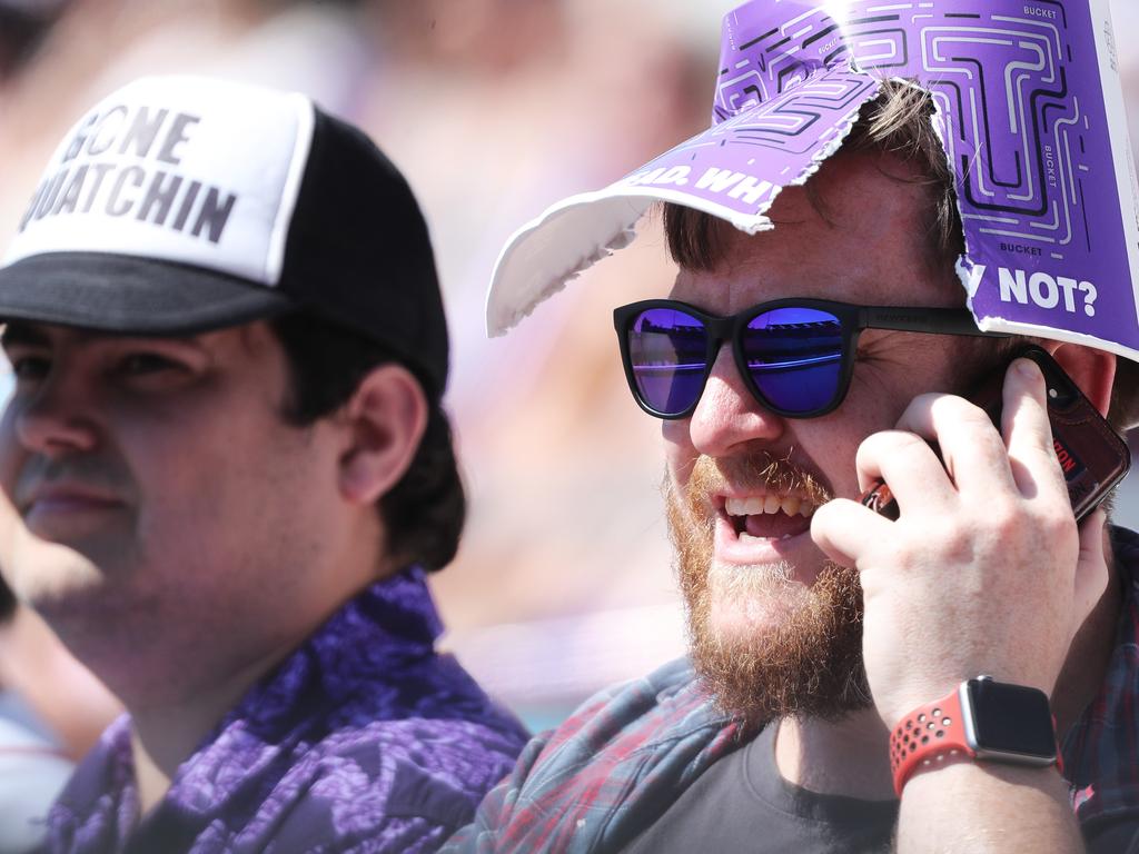 Fans enjoying the hot weather at the Big Bash match between the Hurricanes and Melbourne Stars at Blundstone Arena on Christmas Eve. Picture: LUKE BOWDEN