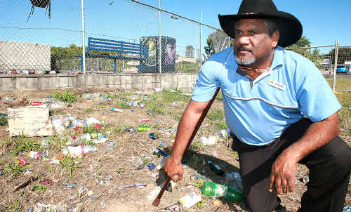 Fraser Coast councillor Les MucKan is annoyed that rubbish thrown over the fence from the Hervey Bay skate park could have been put in the almost-empty bin behind him.