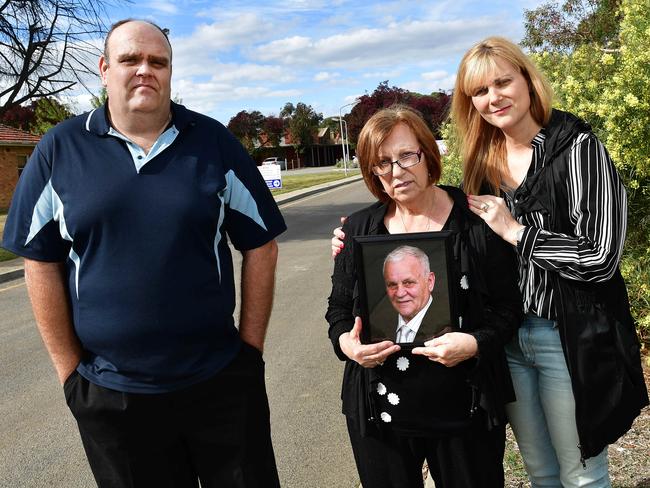 Oakden whistleblowers Stewart Johnston, Rina Serpo (holding a photo of her husband Eddie Serpo, who was a resident) and her daughter Alma Krecu outside the facility. Picture: Keryn Stevens