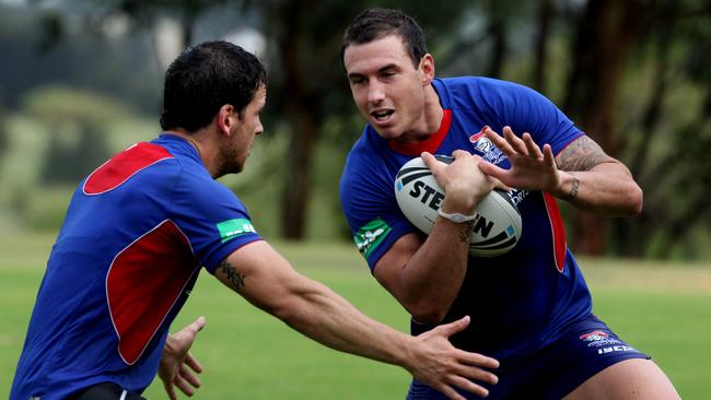 Jarrod Mullen (L) and Darius Boyd during Newcastle Knights NRL training at Newcastle University in Newcastle.