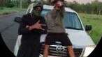 Cairns crims pose up in front of a stolen Toyota LandCruiser.