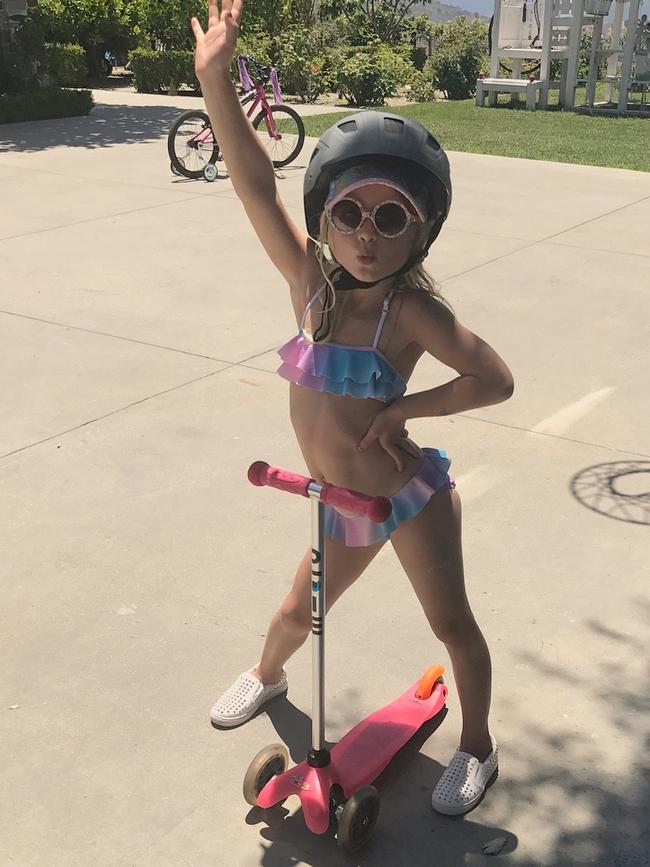 Jessica Simpson gets her daughter started with her signature look - big sunnies and a bikini... Safety first #MAXIDREW.
