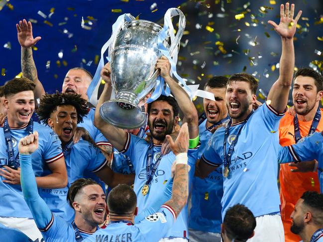 ISTANBUL, TURKEY - JUNE 10:  Ilkay Gundogan of Manchester City lifts the trophy and celebrates with team mates after the UEFA Champions League 2022/23 final match between FC Internazionale and Manchester City FC at Atatuerk Olympic Stadium on June 10, 2023 in Istanbul, Turkey. (Photo by Craig Mercer/MB Media/Getty Images)