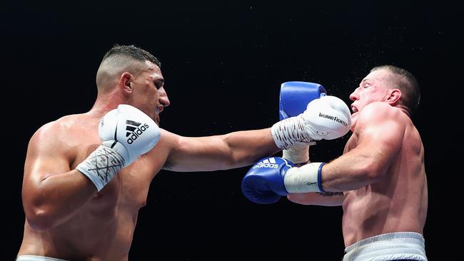 SYDNEY, AUSTRALIA – JUNE 16: Justis Huni punches Paul Gallen during their Australian heavyweight title fight during the Australian heavyweight title fight between Justis Huni and Paul Gallen at ICC Sydney on June 16, 2021 in Sydney, Australia. (Photo by Cameron Spencer/Getty Images)