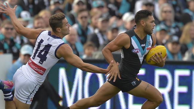 Jarman Impey breaks away from Fremantle’s Lachie Weller. Picture: David Mariuz