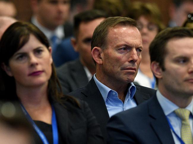 Former prime minister Tony Abbott watches on as Prime Minister Malcolm Turnbull delivers an address at the 59th Liberal Party Federal Council Meeting in Sydney, Saturday, June 24, 2017. (AAP Image/Dan Himbrechts) NO ARCHIVING