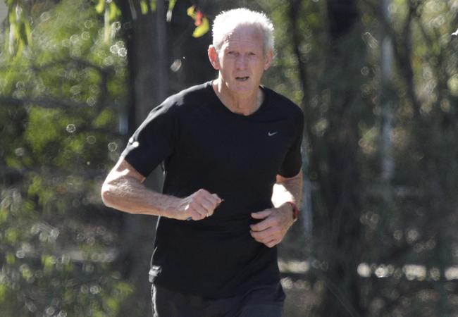 Wayne Bennett pounds the pavements of Brisbane recently.