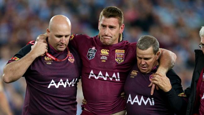 QLD's Brent Tate helped off injured during Game 2 of the 2014 State of Origin series at ANZ Stadium .Picture Gregg Porteous