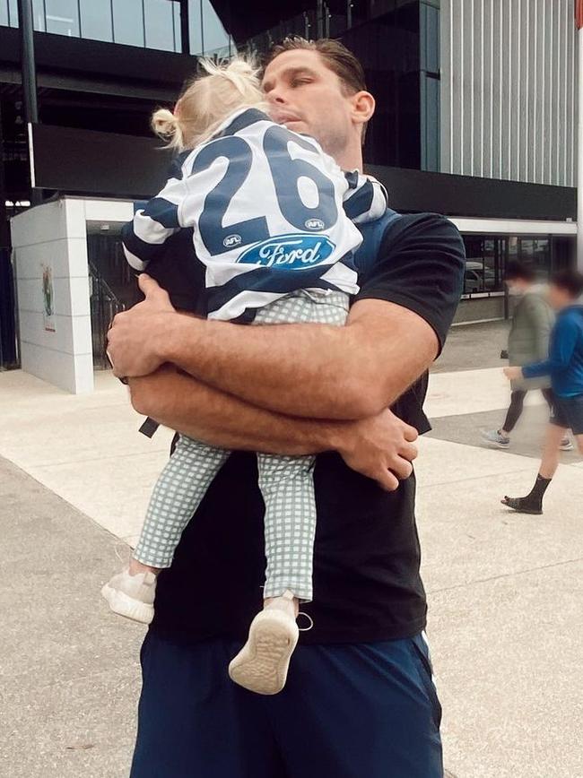 Tom Hawkins with his daughter post-game.