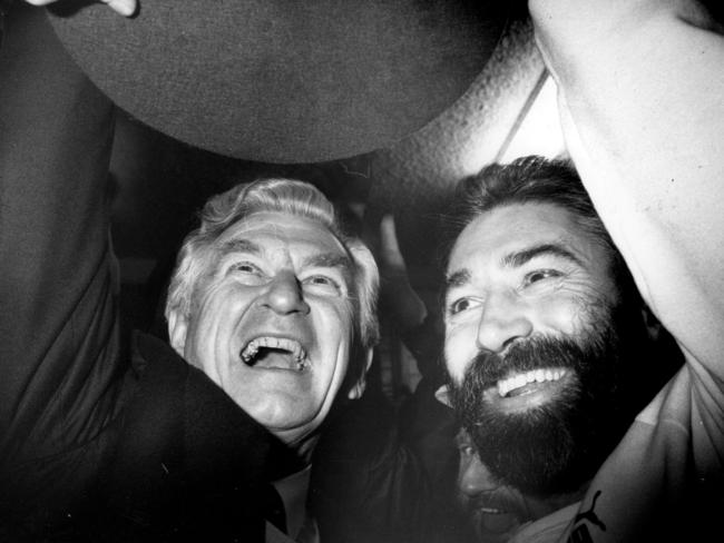 Prime Minister Bob Hawke celebrates the 1988 premiership win with Phil Cleary. Picture: Genevieve Edwards. 