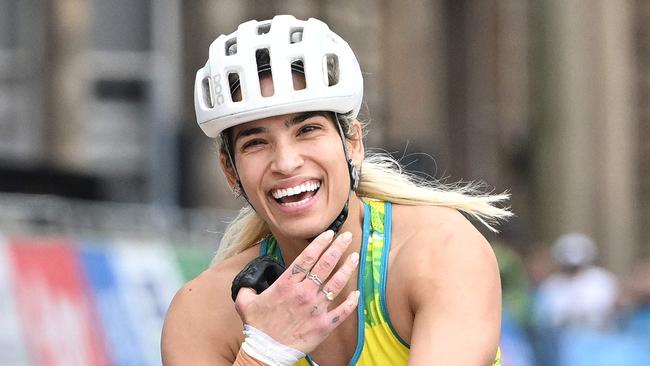 Madison de Rozario crosses the finish line to win the para-women's T53/54 marathon final at the Commonwealth Games. Picture: Andy Buchanan / AFP