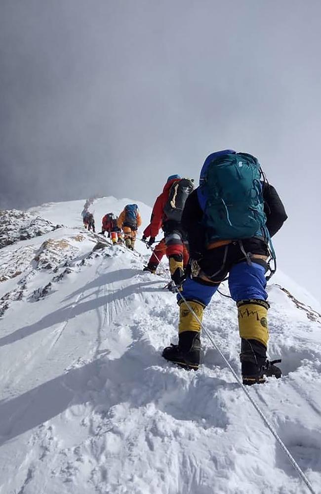 A long line of mountaineers ascend on their way to the summit of Mount Everest. Picture: AFP