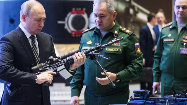 Russian President Vladimir Putin and Defence Minister Sergei Shoigu tour a military gear exhibition before the annual meeting of the Defence Ministry board in Moscow on December 21, 2021. Picture: Mikhail Metzel/Sputnik/AFP