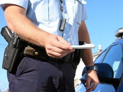 ROADSIDE: Generic drug driving image with police officer.