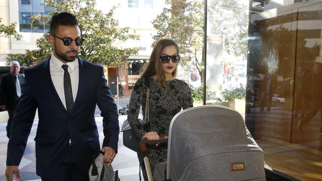 Salim Mehajer's sister Fatima in court with a pram and her partner by her side.