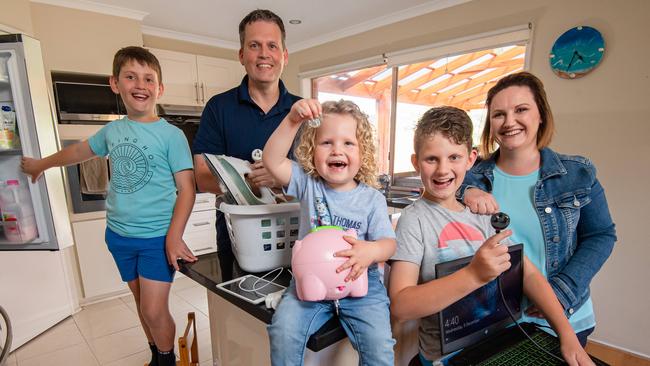 Nikki Brownlie, far right, and her husband Craig (top right) are savvy with their energy deals. Picture: Jason Edwards