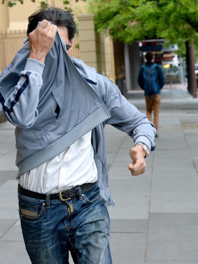 Raphael Azariah runs from the Supreme Court on Wednesday. Picture: Greg Higgs.