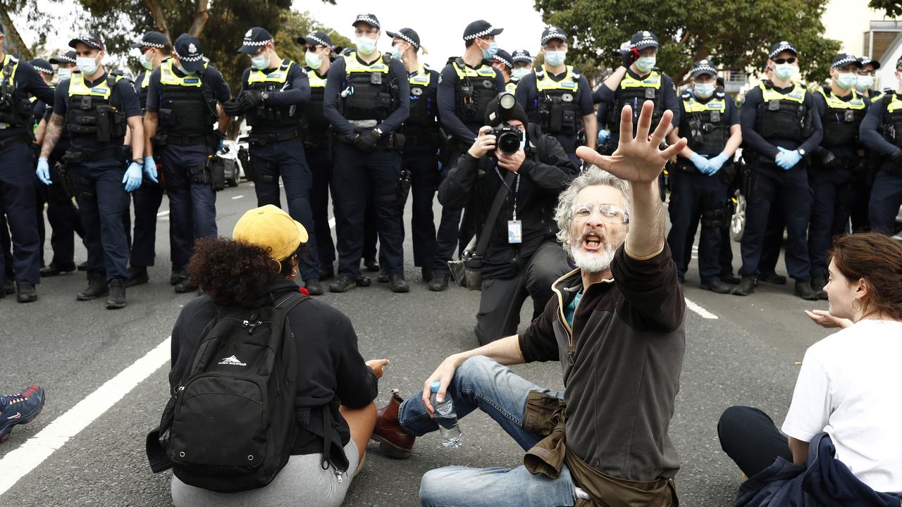 Anti lockdown protesters form a sit-in. (Photo by Darrian Traynor/Getty Images)