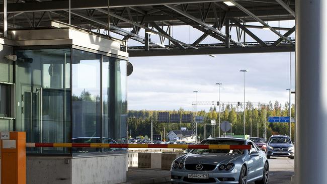 Cars with Russian number plates wait to cross the border from Russia to Finland at the Nuijamaa border checkpoint in Lappeenranta, Finland. Picture: AFP.