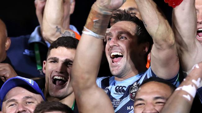 Mitchell Pearce (R) and Nathan Cleary (L) celebrate the win. Picture: Phil Hillyard