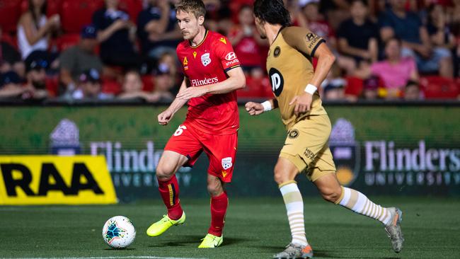 Adelaide United’s Ben Halloran carries the ball forward against Western Sydney. Picture: Daniel Kalisz/Getty Images