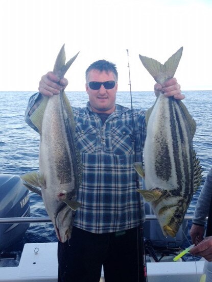 Stuart Blackwell with two nice striped trumpeter from Musselroe Bay.