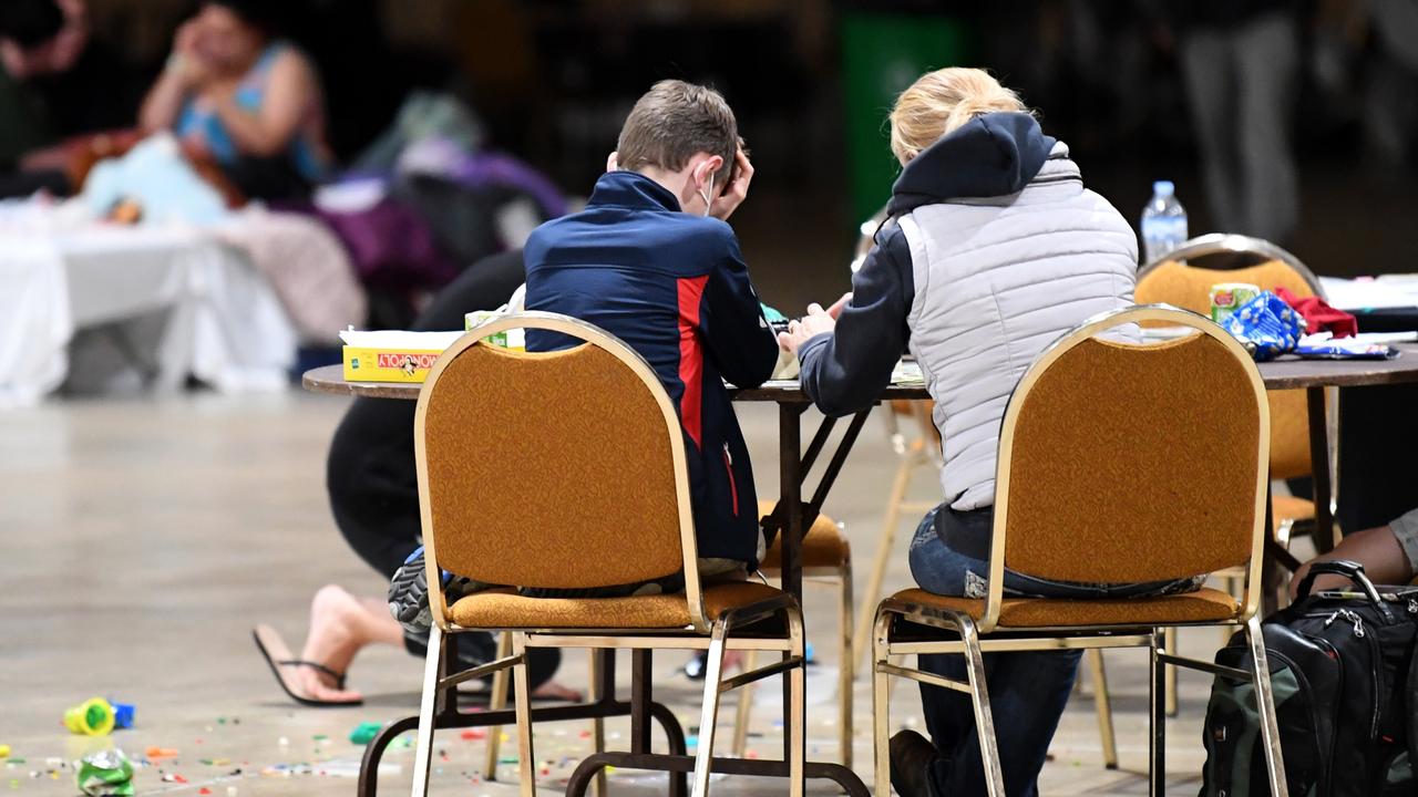 People take shelter at an evacuation centre at Ipswich on Sunday evening. Picture: Dan Peled/Getty Images