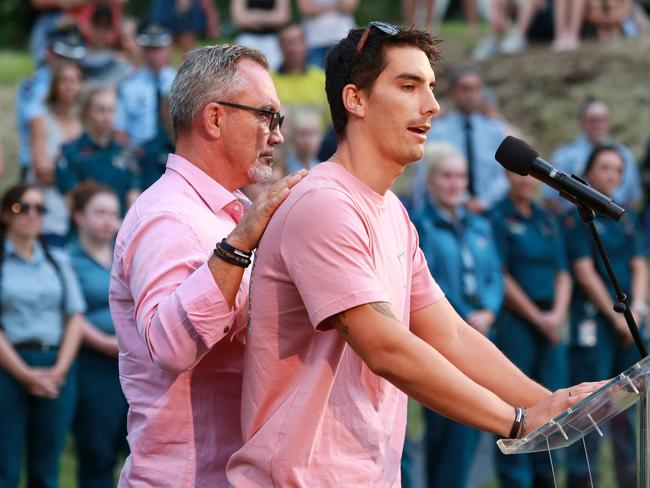 Hannah Clarke’s brother Nathaniel Clarke, being supported by his dad Lloyd, while speaking about the family at a public memorial at Bill Hewitt Reserve in Brisbane. Picture: Sarah Marshall