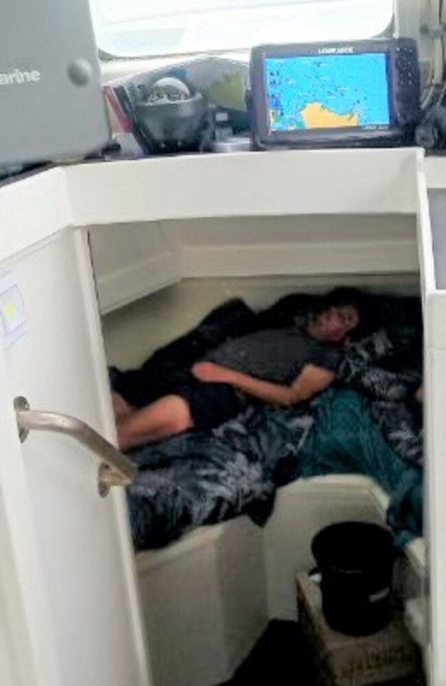 The rescued couple asleep in Lorne Benussi's yacht.