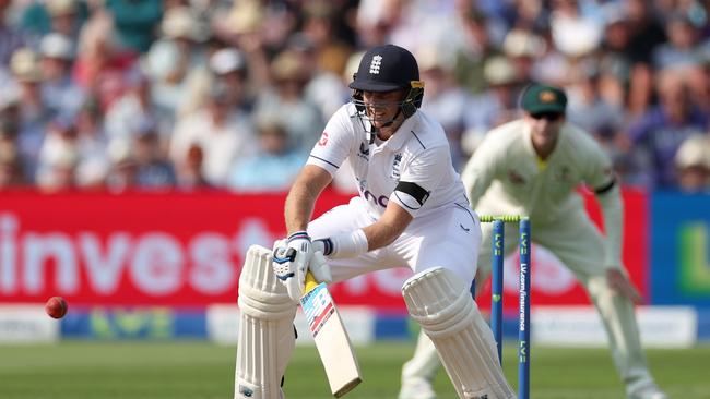 Joe Root plays a reverse ramp shot off Pat Cummins - which went for six. Picture: Getty