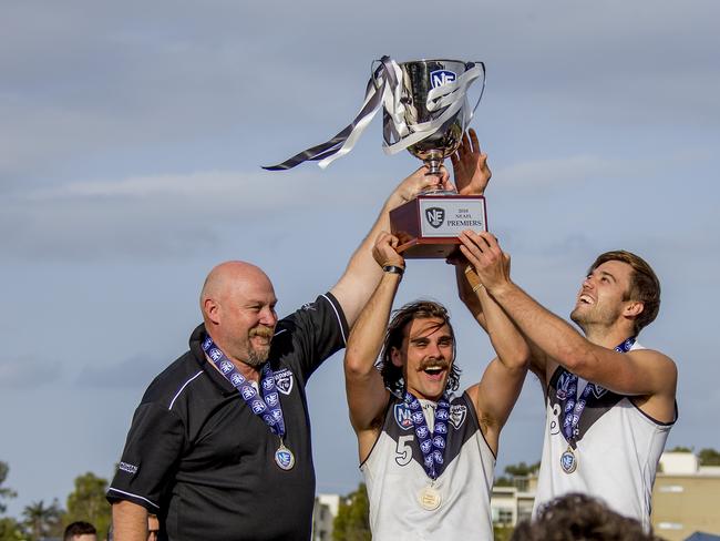 Grand final of the NEAFL between the Southport Sharks and the Sydney Swans at Fankhauser Reserve, Southport, on Sunday. Southport Sharks coach Stephen Daniel celebrates with captains, Andrew Boston and Seb (Sebastian) Tape Picture: Jerad Williams