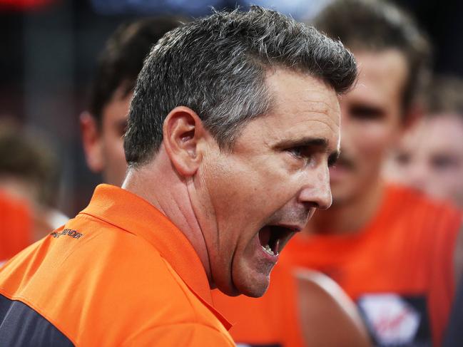 EMBARGOED - GWS Feature - Check with DT Sport before use -GWS Giants game day feature during their match against Brisbane Lions at Spotless Stadium. Coach Leon Cameron gives his side an old fashioned 3/4 time spray. Picture. Phil Hillyard