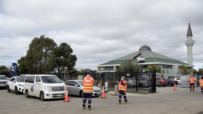 People queue at a Covid testing centre at Al-Taqwa College in Truganina today. Picture: Andrew Henshaw