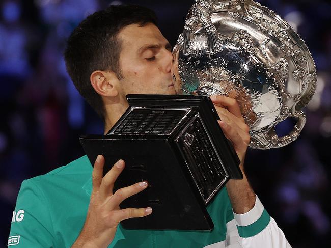 Australian Open tennis. 21/02/2021. Day 14...   Mens Final. Novak Djokovic vs Daniil Medvedev on Rod Laver Arena.  Novak Djokovic holds the winners trophy aloft after winning in straight sets   . Pic: Michael Klein