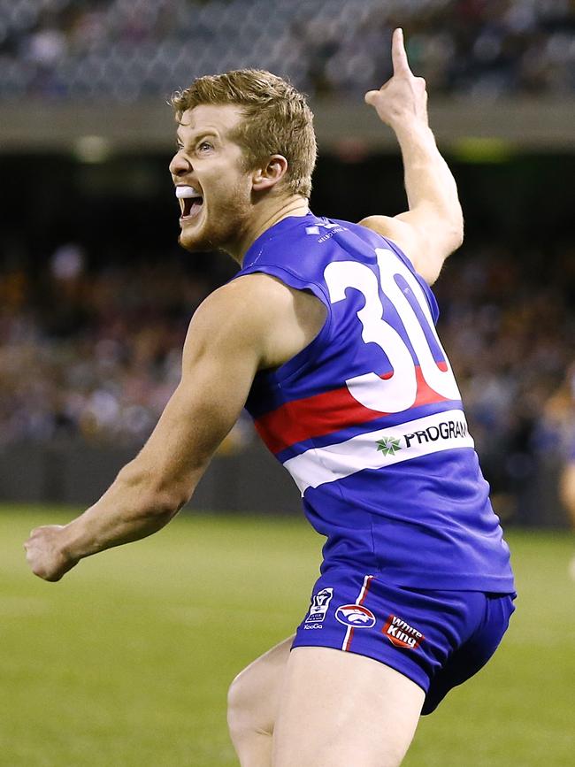 Morphettville Park’s Christian Howard celebrates kicking a goal for the Bulldogs during the club’s VFL grand final against Box Hill in 2014. Picture: Wayne Ludbey