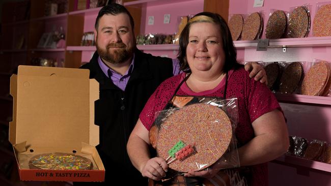 Rebecca Day and husband Sean with a chocolate pizza and giant chocolate freckle. Picture: AAP/Morgan Sette