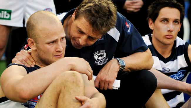 NOT FOR INTERNET... 27/09/2008 SPORT: 2008 AFL Grand Final - Geelong v Hawthorn at MCG. Coach Mark Thompson console's a teary Gary Ablett