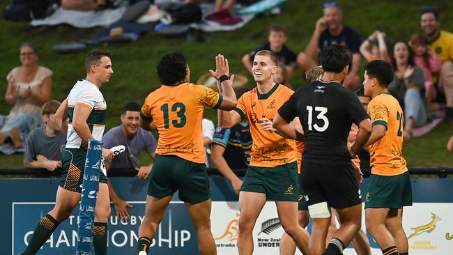 Will McCulloch of Australia celebrates with teammates after scoring a try during The Rugby Championship U20 Round 3 match between Australia and New Zealand at Sunshine Coast Stadium on May 12, 2024 in Sunshine Coast, Australia. (Photo by Albert Perez/Getty Images)