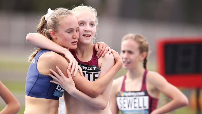 Amy Bunnage of Victoria and Isabella Harte of Queensland embrace. (Photo by Mark Kolbe/Getty Images)