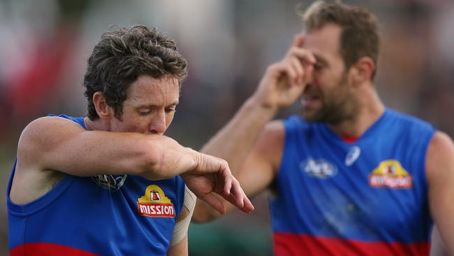 Bob Murphy and Travis Cloke react after the match. Picture: Wayne Ludbey