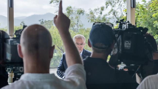 You’re out (of time), Prime Minister! Press secretary Andrew Carswell can be seen with his back to the camera, gesturing to his boss Scott Morrison. Picture: Jason Edwards