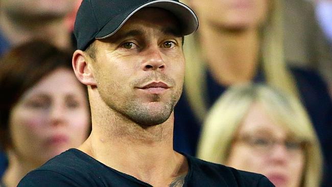 AFL Footballer Jake King looks on in the men's final match between Rafael Nadal of Spain and Stanislas Wawrinka.