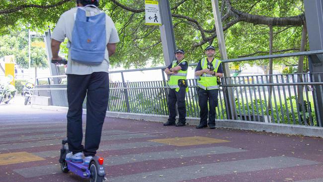 QPS officers at the Goodwill Bridge, Brisbane City, checking the speed of cyclists and e-scooter riders.