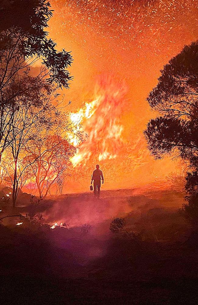 A volunteer firefighter labelled simply ‘Poster Boy’ takes a break during efforts to contain monster fire that has consumed 1200 hectares of outback bush west of Townsville in just two weeks. Picture: Torrens Creek Rural Fire Brigade