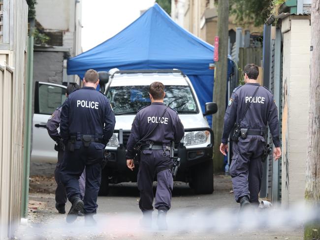 Police continue to search the Cleveland St residence in Surry Hills. Picture: John Grainger