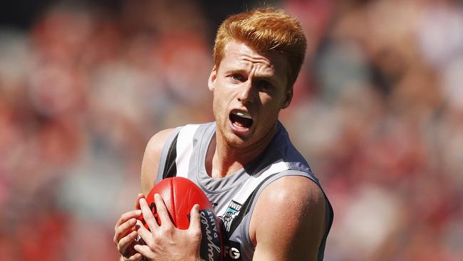 Willem Drew marks on his way to 21 disposals on debut for Port Adelaide against Melbourne at the MCG on Saturday. Picture: Daniel Pockett (AAP).