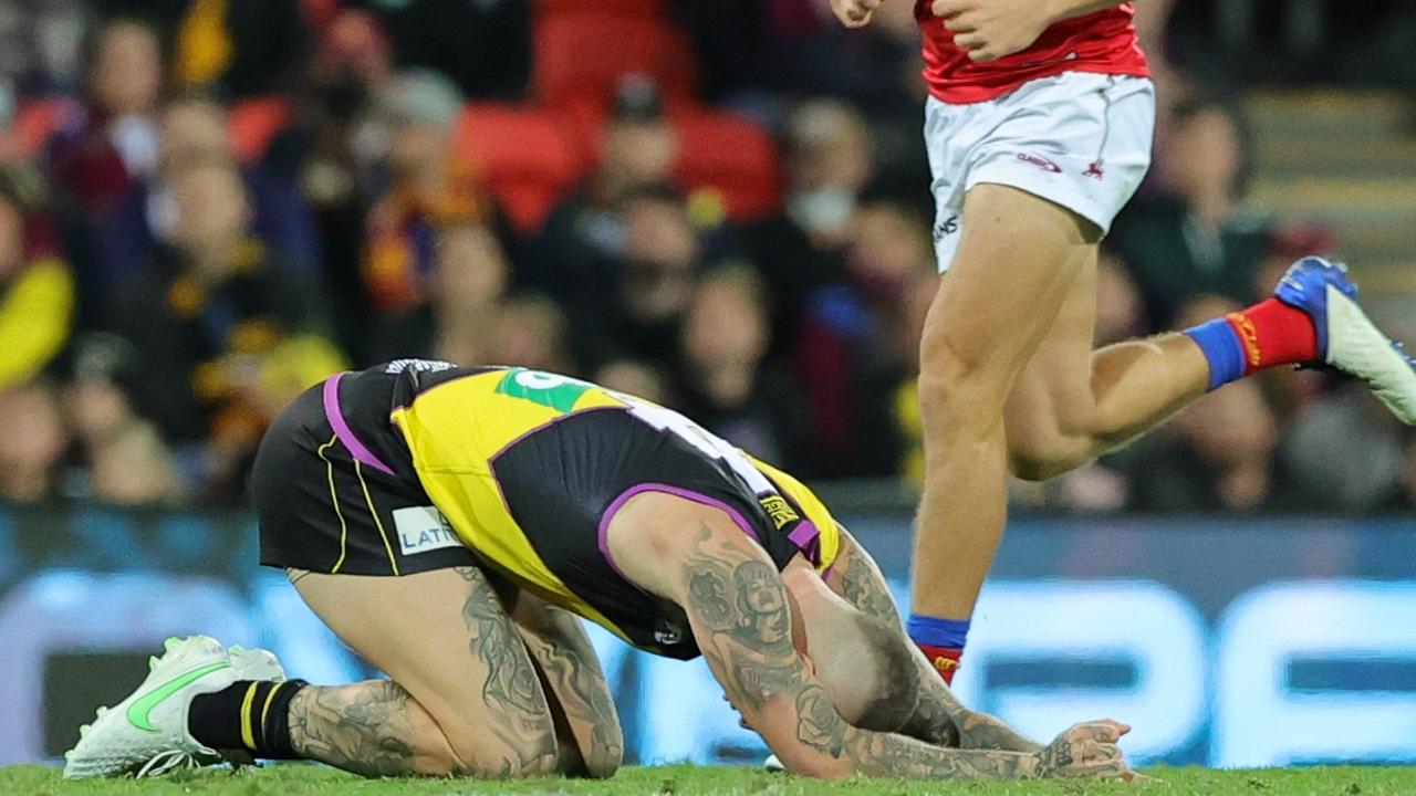 Martin on the ground after the accidental kick. Picture: AFL Photos